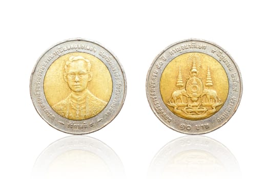 Front and back of Thai coin 10 baht reflect on white background.