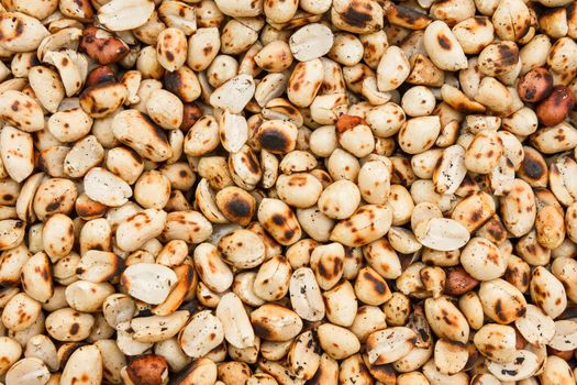 Pile of peeled roasted peanut.