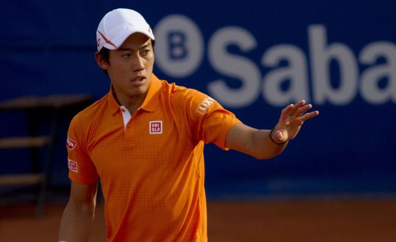 SPAIN, Barcelona: Japanese tennis player Kei Nishikori  stands during the final of the ATP Barcelona Open Conde de Godo tennis tournament in Barcelona on April 24, 2015. Rafael Nadal equalled Argentine legend Guillermo Vilas's record of 49 clay-court titles with his ninth Barcelona Open after overcoming defending champion Kei Nishikori 6-4, 7-5 today. 