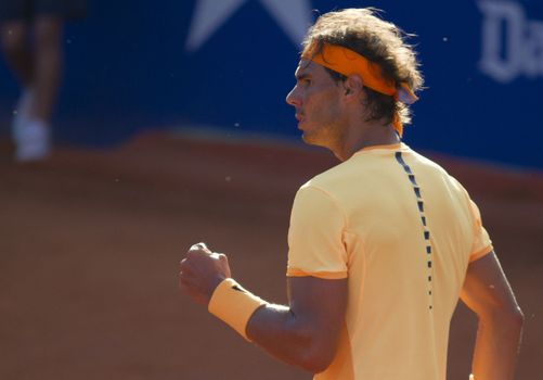 SPAIN, Barcelona: Spanish tennis player Rafael Nadal celebrates defeating Japanese tennis player Kei Nishikori during the final of the ATP Barcelona Open Conde de Godo tennis tournament in Barcelona on April 24, 2015. Rafael Nadal equalled Argentine legend Guillermo Vilas's record of 49 clay-court titles with his ninth Barcelona Open after overcoming defending champion Kei Nishikori 6-4, 7-5 today. 