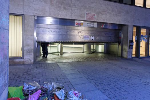 BELGIUM, Brussels : A passager walks in front of Maelbeek - Maalbeek metro station on its re-opening day on April 25, 2016 in Brussels, after being closed since the 22 March attacks in the Belgian capital.Maelbeek - Maalbeek metro station was hit by one of the three Islamic State suicide bombers who struck Brussels airport and metro on March 22, killing 32 people and injuring hundreds.