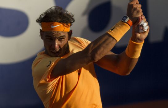 SPAIN, Barcelona: Spanish tennis player Rafael Nadal returns the ball to Japanese tennis player Kei Nishikori during the final of the ATP Barcelona Open Conde de Godo tennis tournament in Barcelona on April 24, 2015. Rafael Nadal equalled Argentine legend Guillermo Vilas's record of 49 clay-court titles with his ninth Barcelona Open after overcoming defending champion Kei Nishikori 6-4, 7-5 today. 