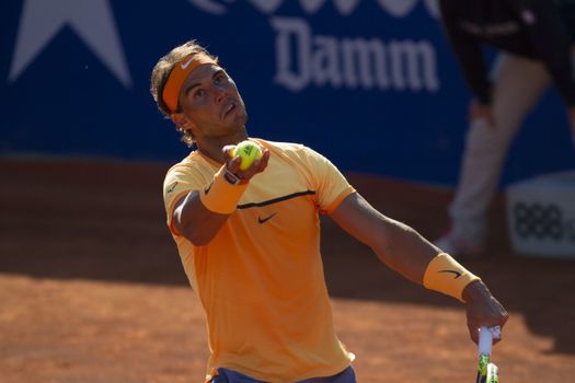 SPAIN, Barcelona: Spanish tennis player Rafael Nadal returns the ball to Japanese tennis player Kei Nishikori during the final of the ATP Barcelona Open Conde de Godo tennis tournament in Barcelona on April 24, 2015. Rafael Nadal equalled Argentine legend Guillermo Vilas's record of 49 clay-court titles with his ninth Barcelona Open after overcoming defending champion Kei Nishikori 6-4, 7-5 today. 