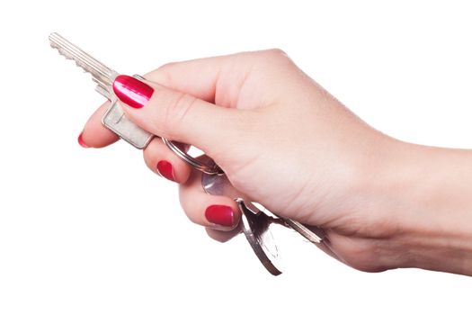 Close up of manicured fingers painted a deep glossy red curling around set of car keys