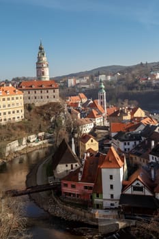 CESKY KRUMLOV, CZECH REPUBLIC - DECEMBER 29, 2015 : General view of Cesky Krumlov city with historical small houses along the river, on blue sky background.