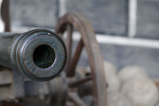 Close up detailed view of old black iron cannon ball.