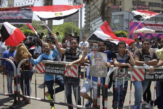 EGYPT, Giza: People wave national flags as they gather in Mostafa Mahmoud Square in Giza, near Cairo on April 25, 2016 to commemorate the thirty-fourth anniversary of Sinai liberation. This same day, thousands of security personnel were deployed around Cairo ahead of mass planned protests over the return of two Red Sea islands to Saudi Arabia, a decision that has provoked some of the most open criticism of President Abdel-Fattah el-Sissi's leadership.