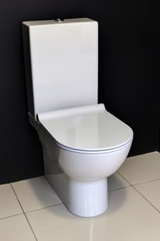 white modern toilet bowl in a bathroom