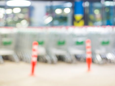 Shopping carts in a shopping mall basement parking - Shopping carts on a parking lot. Blurred image