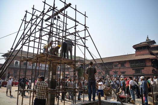 NEPAL, Kathmandu: Men begin rebuilding heritage sites damaged by the earthquake a year ago, on April 25, 2016, at Patan Durbar Square in Kathmandu, in Nepal, during the first anniversary of the quake.Some 9,000 people were killed in the 7.8-magnitude quake that struck April 25, 2015 and its aftershocks. . 