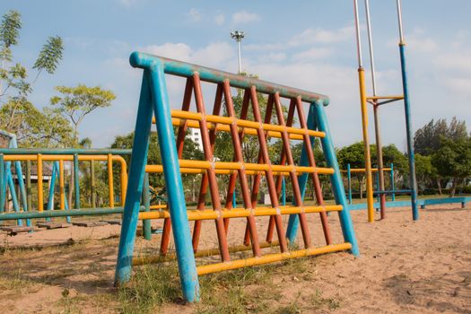 Climbing  fun playing on equipment at a playground.