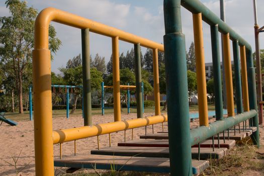 Climbing  fun playing on equipment at a playground.