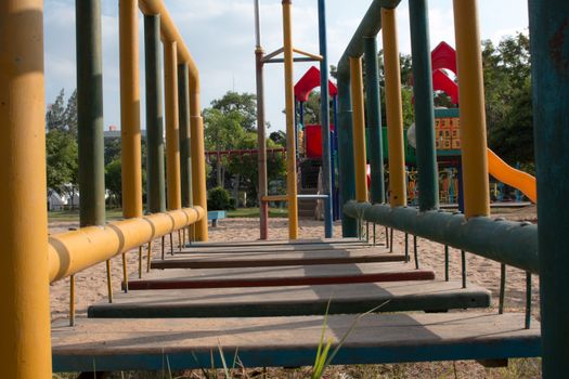 Climbing  fun playing on equipment at a playground.