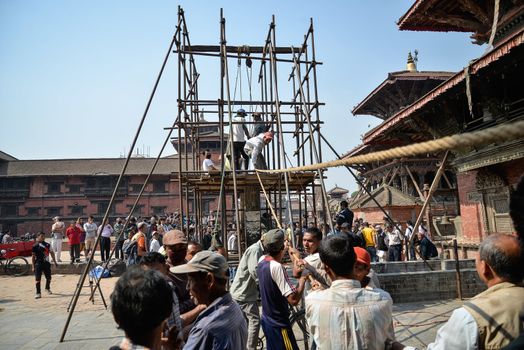 NEPAL, Kathmandu: Men begin rebuilding heritage sites damaged by the earthquake a year ago, on April 25, 2016, at Patan Durbar Square in Kathmandu, in Nepal, during the first anniversary of the quake.Some 9,000 people were killed in the 7.8-magnitude quake that struck April 25, 2015 and its aftershocks. . 