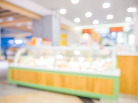 image of blur bakery shop with bokeh for background usage.