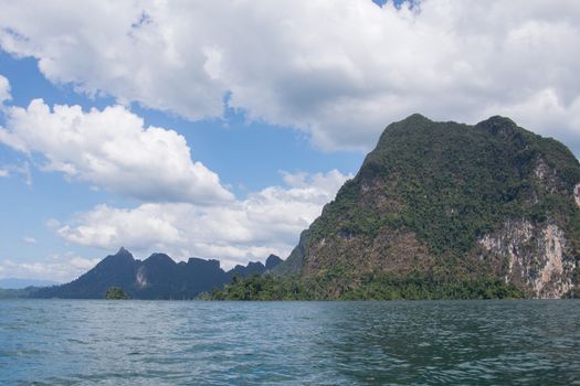 Beautiful mountains behind fog in Ratchaprapha Dam at Khao Sok National Park, Surat Thani, Thailand