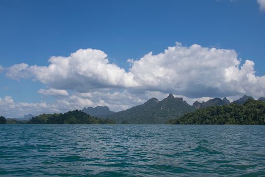 Beautiful mountains behind fog in Ratchaprapha Dam at Khao Sok National Park, Surat Thani, Thailand