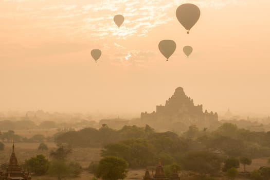 Dhammayangyi temple The biggest Temple in Bagan with balloons and sunrise, Myanmar