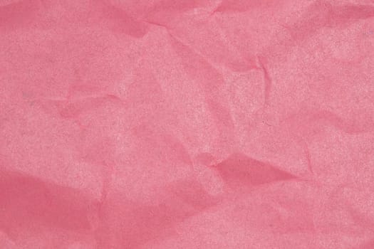 Crumpled paper texture - pink paper sheet.