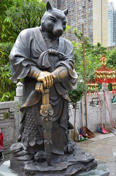 Hong Kong, China - June 25, 2014: Chinese Zodiac Bronze Dog Stature at Sik Sik Yuen Wong Tai Sin Temple