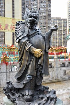 Hong Kong, China - June 25, 2014: Chinese Zodiac Bronze Dragon Stature at Sik Sik Yuen Wong Tai Sin Temple