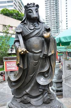 Hong Kong, China - June 25, 2014: Chinese Zodiac Bronze Rat Stature at Sik Sik Yuen Wong Tai Sin Temple