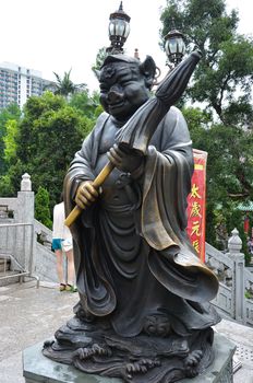 Hong Kong, China - June 25, 2014: Chinese Zodiac Bronze Pig Stature at Sik Sik Yuen Wong Tai Sin Temple