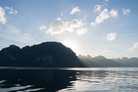 Sun rise behind mountain at Khao Sok National Park, Surat Thani ,Thailand.