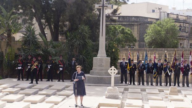 MALTA, Marsa: A woman reads in front of a memorial, for Anzac Day on April 25, 2016, in Malta.The Wreath laying ceremony takes place on the anniversary of the first major military action fought by Australian and New Zealand forces during World War I. Thousands of wounded Australians, New Zealanders, Canadians and English were sent to the tiny Mediterranean island for care during the Gallipoli campaign. ANZAC stands for Australian and New Zealand Army Corps. 