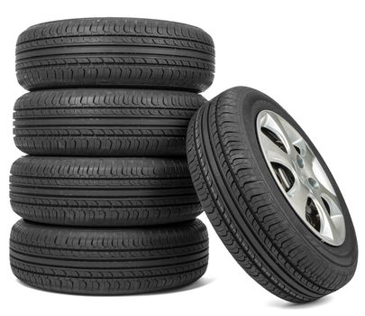 Closeup of five tires, isolated over white background