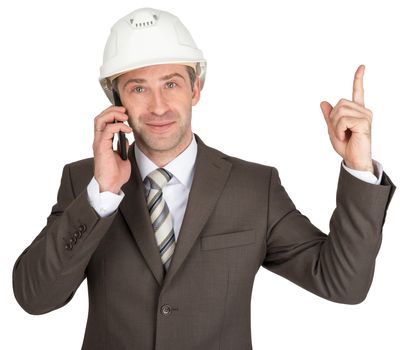 Successful architect in helmet talking on phone and raising finger up. White background