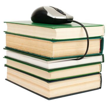 Stack of books with computer mouse on top. Isolated on white background
