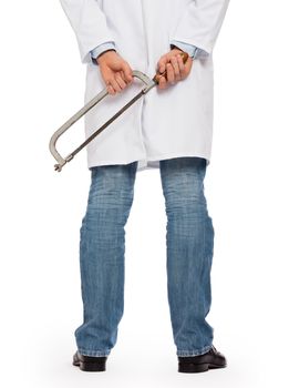 Crazy doctor is holding a big saw in his hands, isolated on white