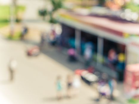 Blurred background of people in Amusement park with bokeh