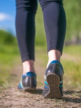 female legs in jogging shoes closeup