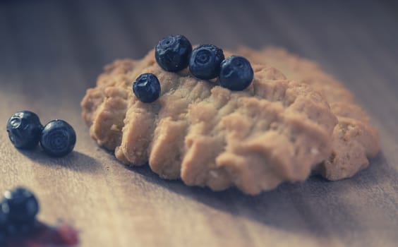 cookies with juicy blueberries, on wooden table
