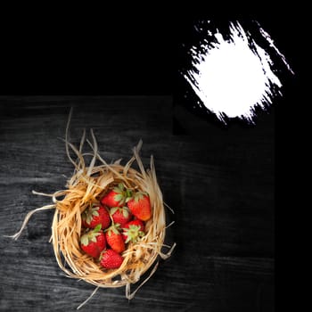 strawberries in a basket - wooden  dark background