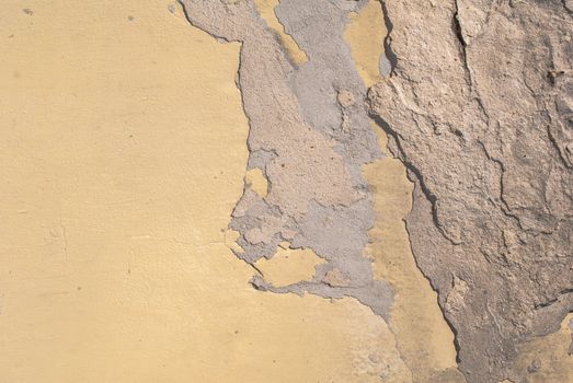 fragment of a concrete wall, which has undergone deformation due to prolonged exposure to various climatic conditions