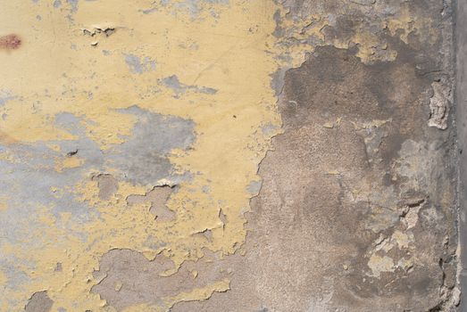fragment of a concrete wall, which has undergone deformation due to prolonged exposure to various climatic conditions