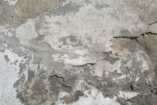fragment of a concrete wall, which has undergone deformation due to prolonged exposure to various climatic conditions