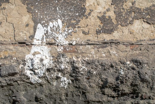 fragment of a concrete wall that for a long time exposed to different climatic conditions