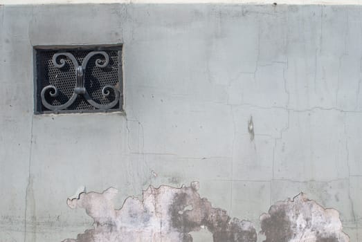 fragment of a concrete wall, which has undergone deformation due to prolonged exposure to various climatic conditions