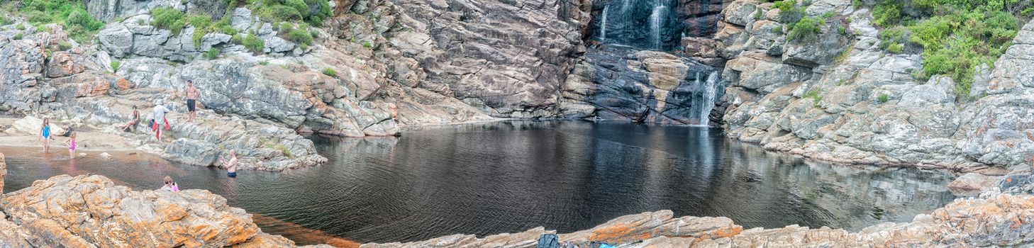 STORMS RIVER MOUTH, SOUTH AFRICA - MARCH 1, 2016:  Unidentified tourists at the pool below the waterfall at the end of the Waterfall Trail which is part of day one of the renowned Otter trail