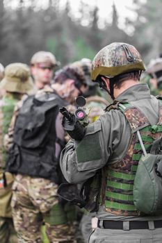 men in military uniform with weapon on a mission