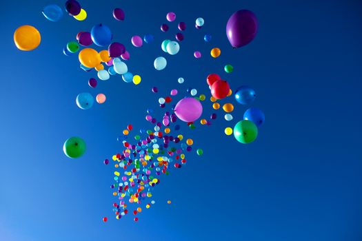 colorful balloons on a blue sky background