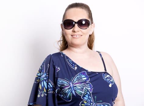 blond woman wearing summer outfit on white background