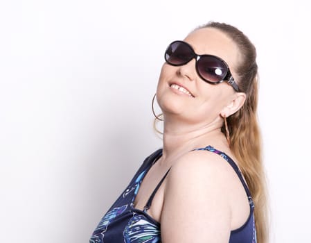 blond woman wearing summer outfit on white background