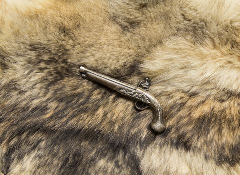 souvenir gun on natural fur wild Wolf