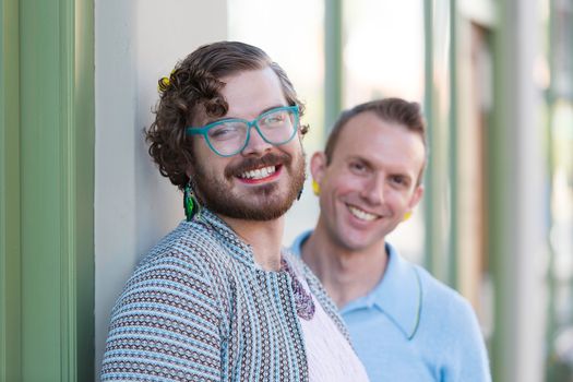 Focus on member of happy gender fluid young male couple