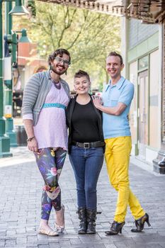 Three gender fluid friends on a city sidewalk